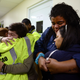 Rescue-team members Candida Lozada and Stephanie Rivera, along with Mary Rodriguez and Zuly Ruiz, embrace as they wait to assist in the aftermath of Hurricane Maria in Humacao, Puerto Rico, on Sept. 20, 2017. (Carlos Giusti/AP Images)